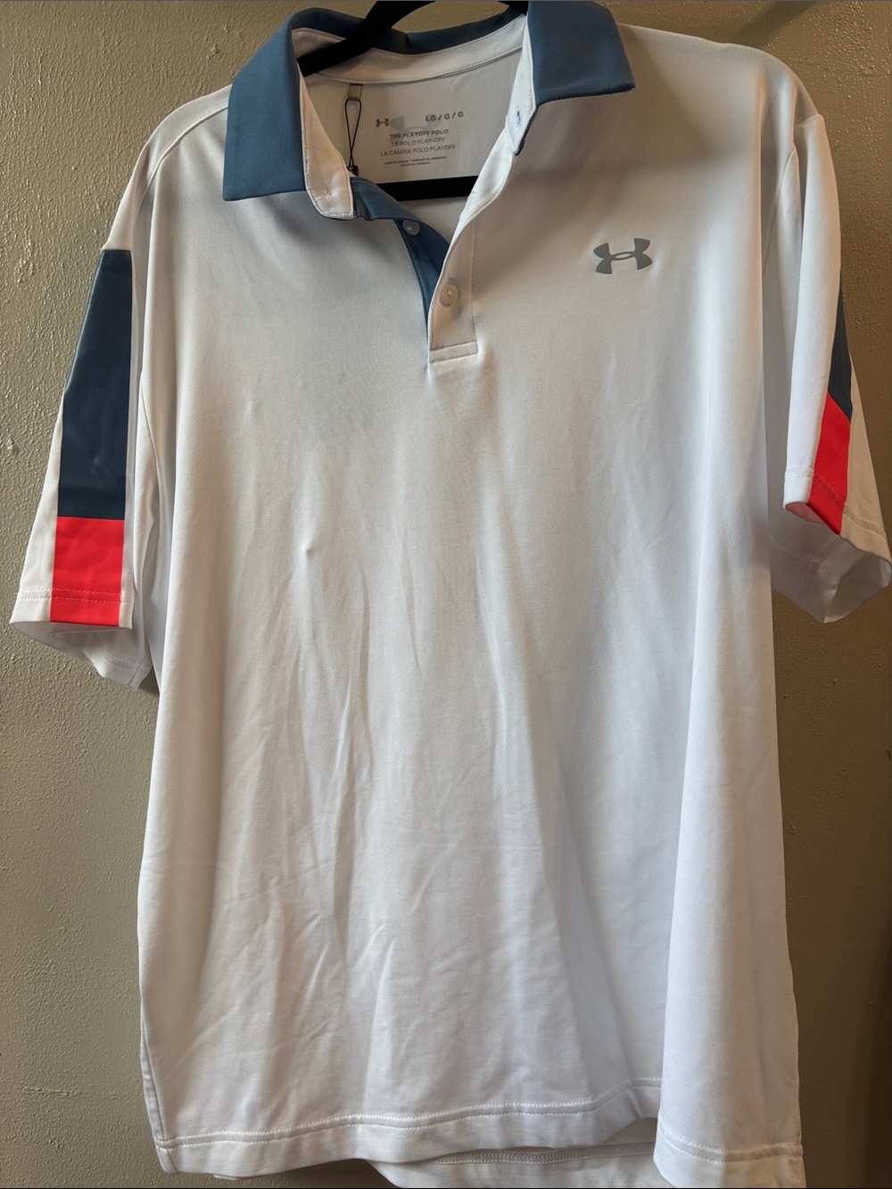 Under Armour Men’s White Polo with blue Collar and orange Sleeve Panels